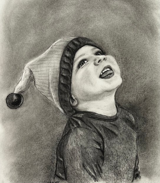 Charcoal drawing of toddler with an elf hat.